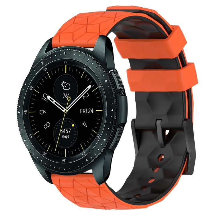 Two-color silicone watch band with geometric football pattern, orange and black