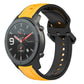 Two-color silicone watch band with orange outer loops and black perforated strap.