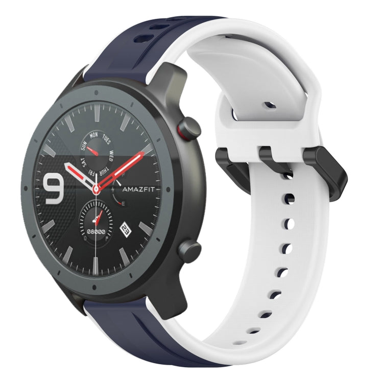 Two-color silicone watch band with dark blue outer loops and white perforated strap.