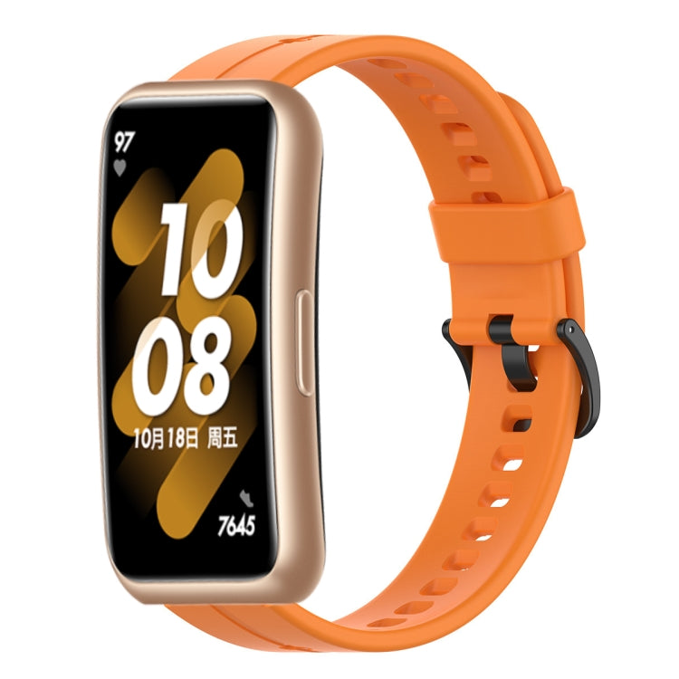 Orange silicone watch band with perforated strap and adjustable pin buckle