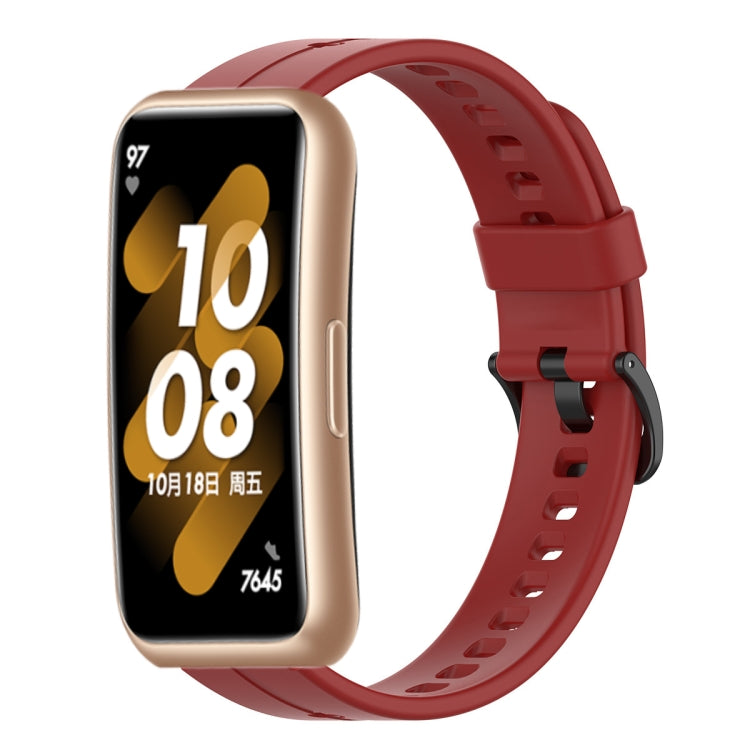 Red silicone smartwatch strap with metal clasp and perforated holes