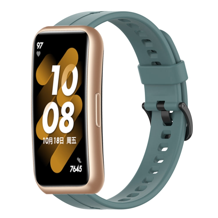 Teal silicone smartwatch strap with metal clasp and perforated holes