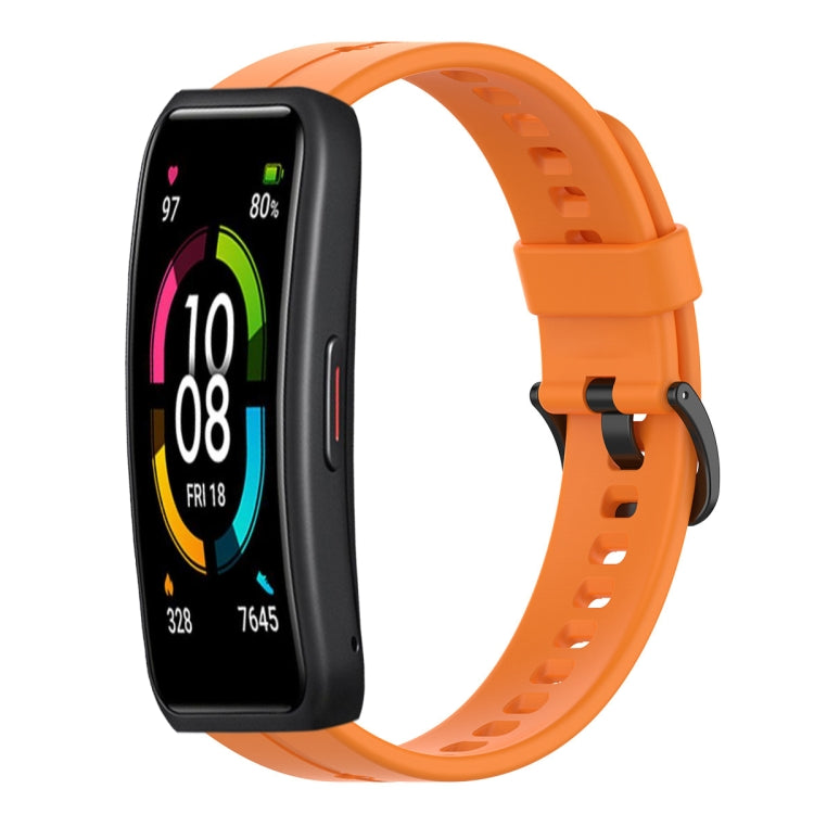 Orange silicone watch band with perforated links and secure pin buckle