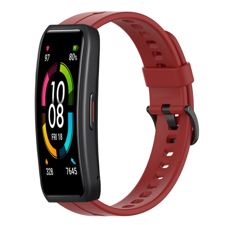 Red silicone smartwatch strap with buckle clasp and perforated holes