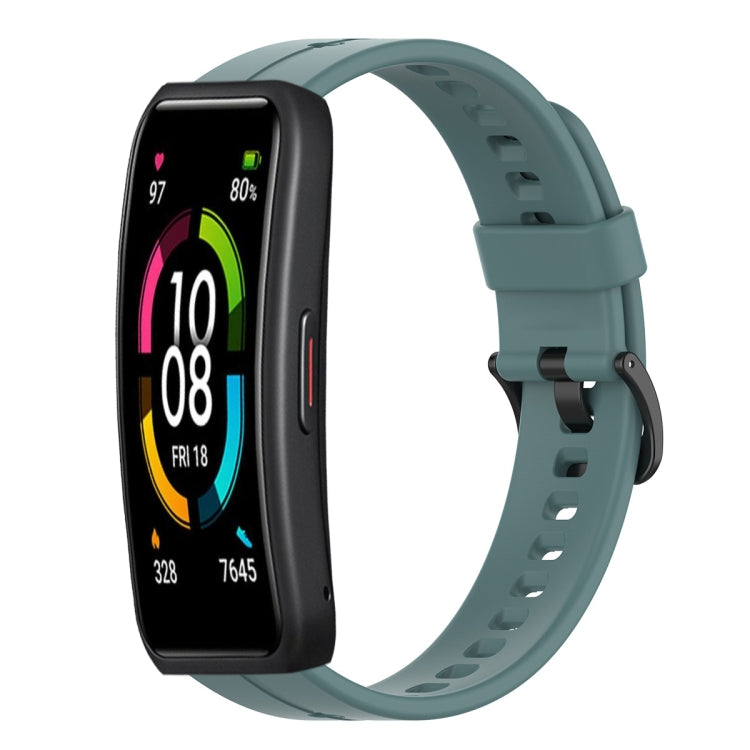 Teal silicone smartwatch strap with metal clasp and perforated holes, front view