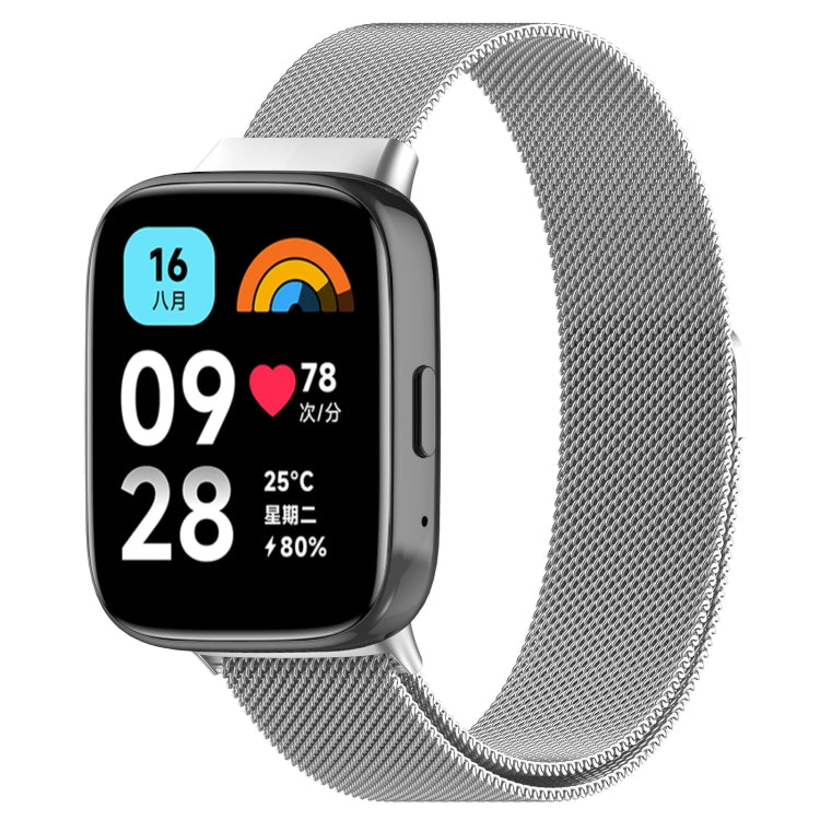 Silver metal mesh magnetic watch band with connector on a smartwatch