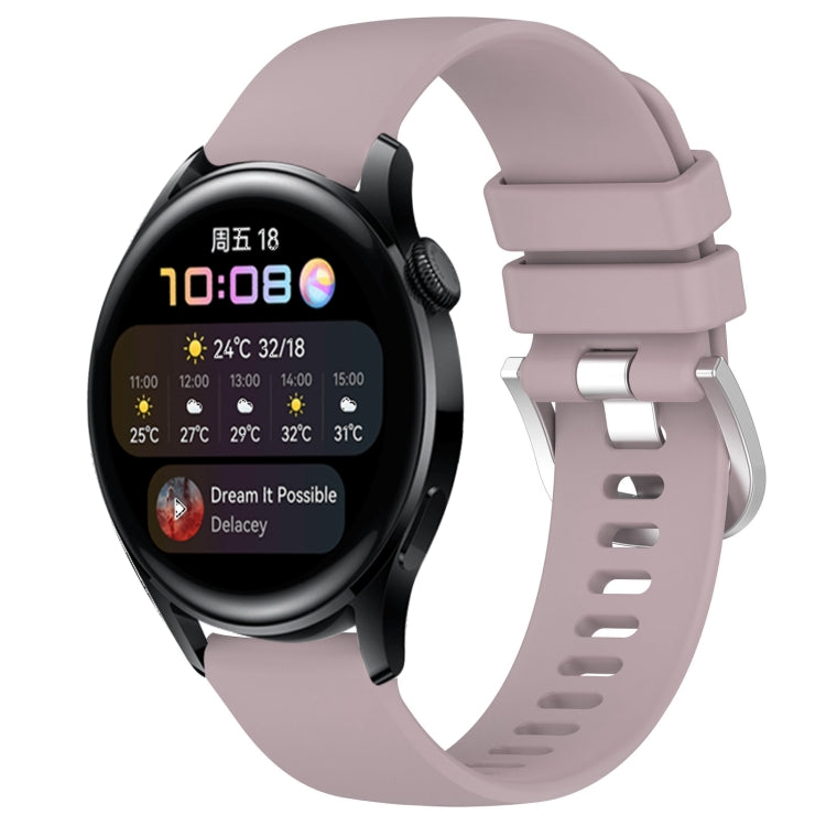 Light purple silicone watch band with glossy buckle and perforated strap, smartwatch attached