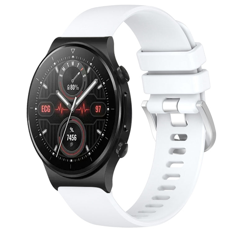 White silicone watch band with glossy buckle and perforated strap, smartwatch attached