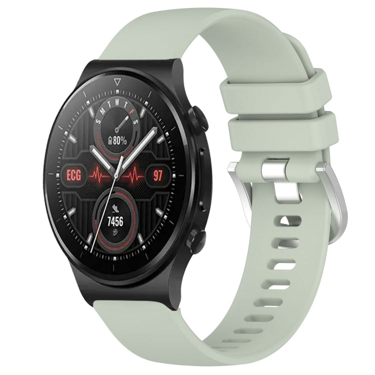 Silicone watch band with silver buckle, light green color, for smartwatch.
