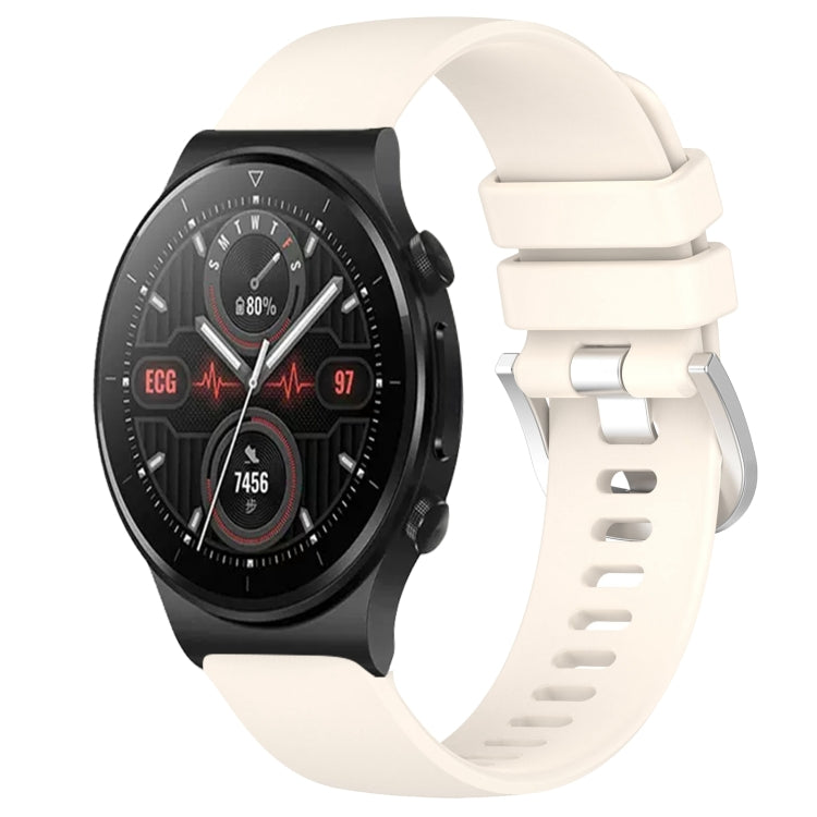 Silicone watch band with silver buckle, off-white color, for smartwatch.