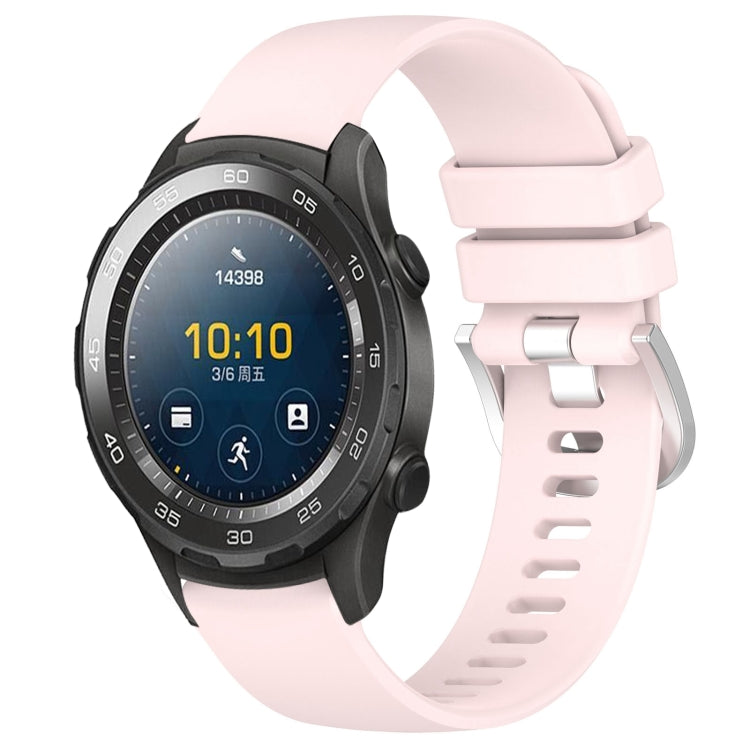 Pink glossy silicone watch band with silver buckle, adjustable holes and loop tabs.