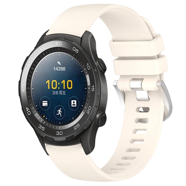 White glossy silicone watch band with silver buckle, adjustable holes and secure clasp.