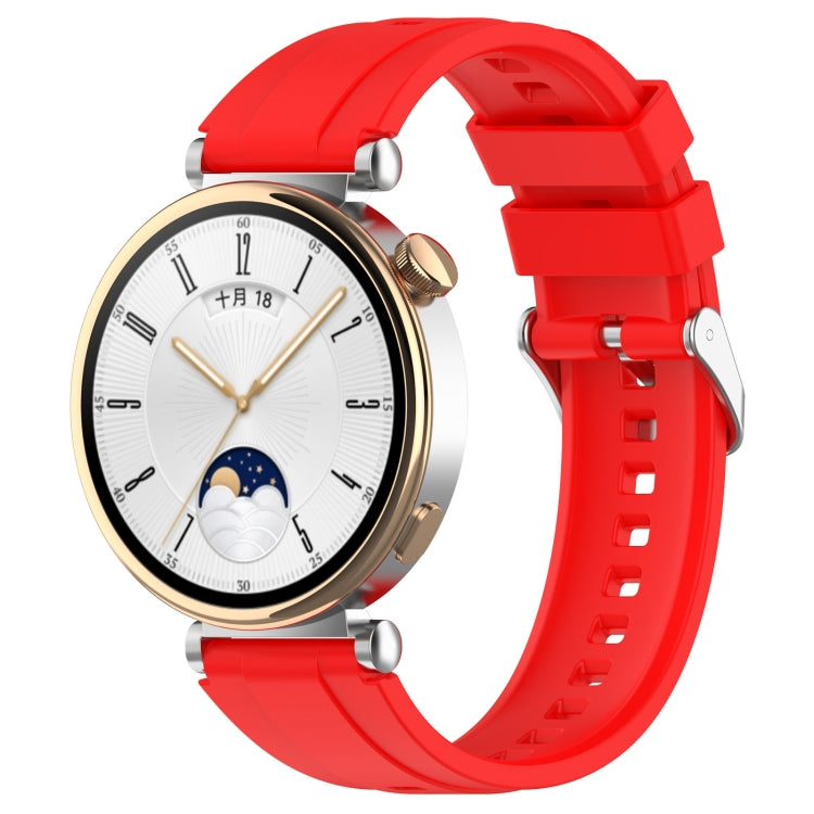 Red silicone watch band with silver buckle clasp and adjustment holes