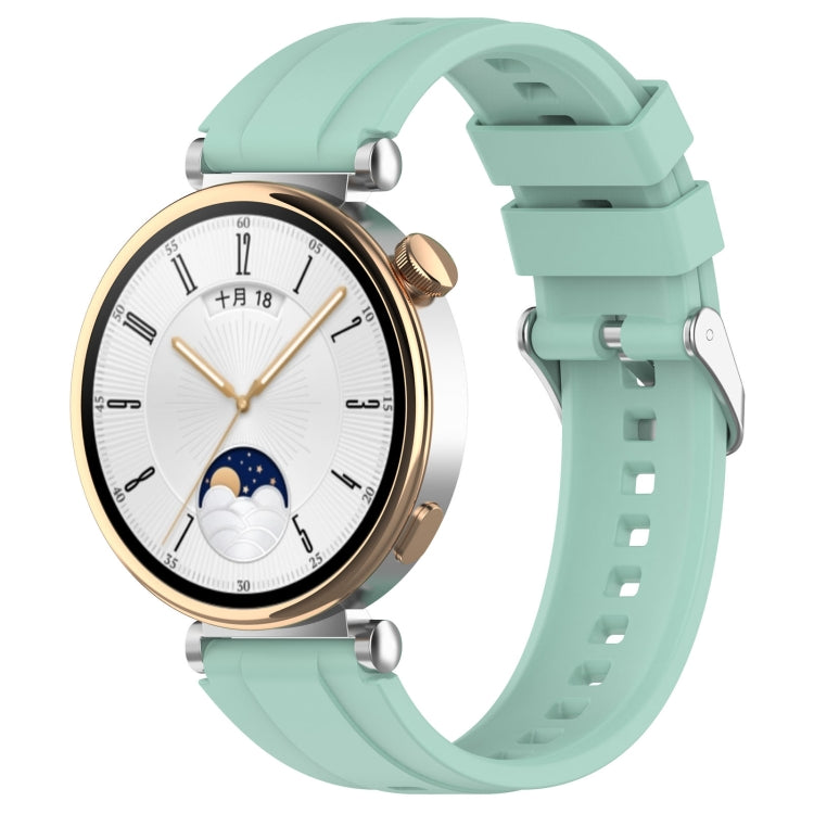 Silicone watch band with silver buckle, mint green.