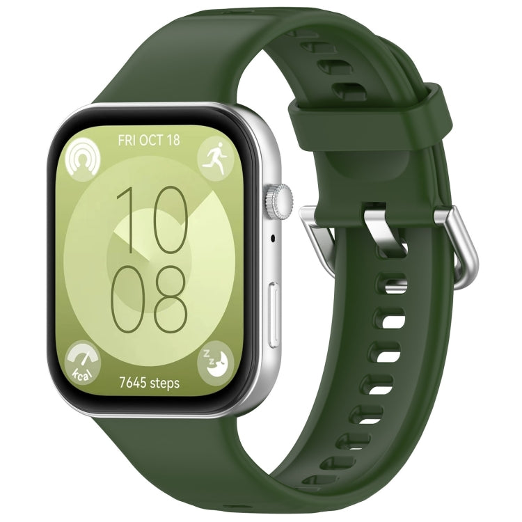 Dark green silicone sports watch band with silver buckle, shown fitted to a watch