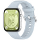 Light blue silicone sports watch band with silver buckle, shown fitted to a watch
