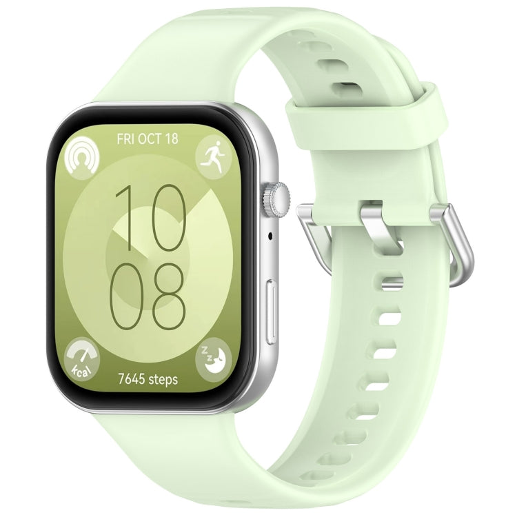 Pale green silicone sports watch band with silver buckle, shown fitted to a watch