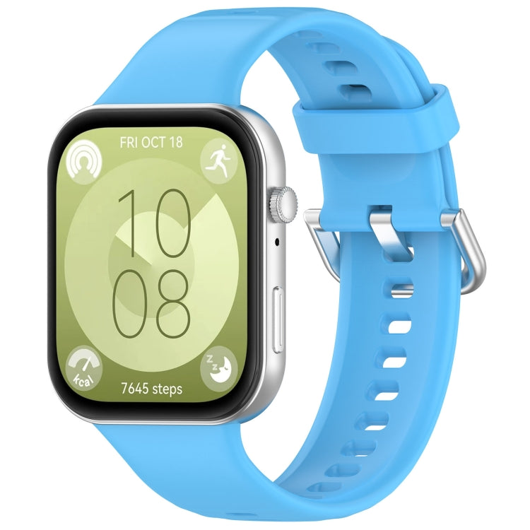 Light blue silicone sports watch band with silver buckle, shown attached to a smartwatch.