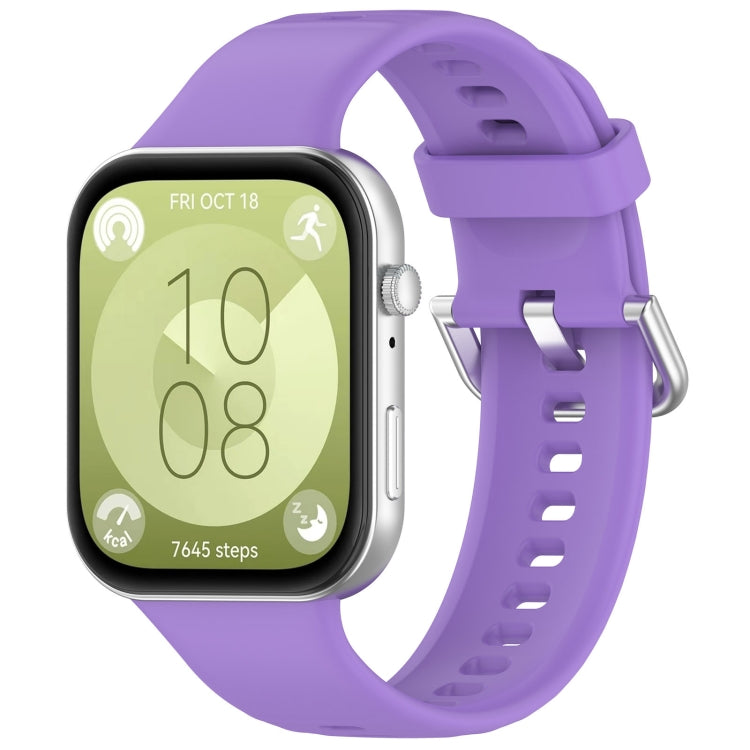 Purple silicone sports watch band with silver buckle, shown attached to a smartwatch.