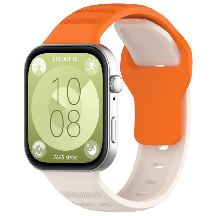 Orange and white silicone sports watch band with textured grip sections, shown on a smartwatch.