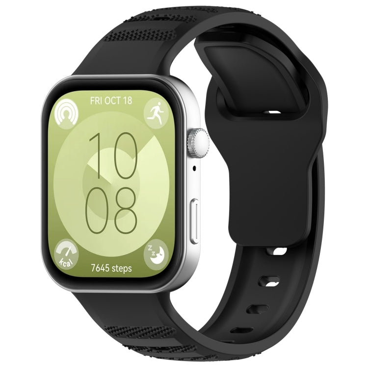 Black silicone sports watch band with textured grip sections, shown attached to a smartwatch.