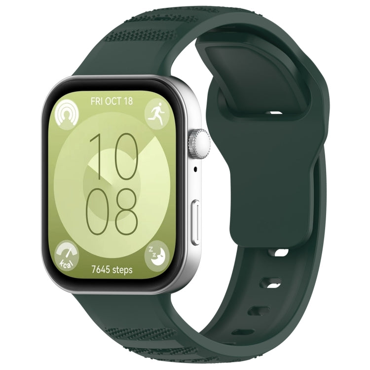 Green silicone sports watch band with textured grip sections, shown attached to a smartwatch.