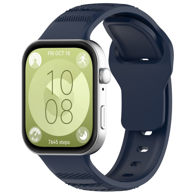 Midnight blue silicone sports watch band with textured grip sections, shown attached to a smartwatch.