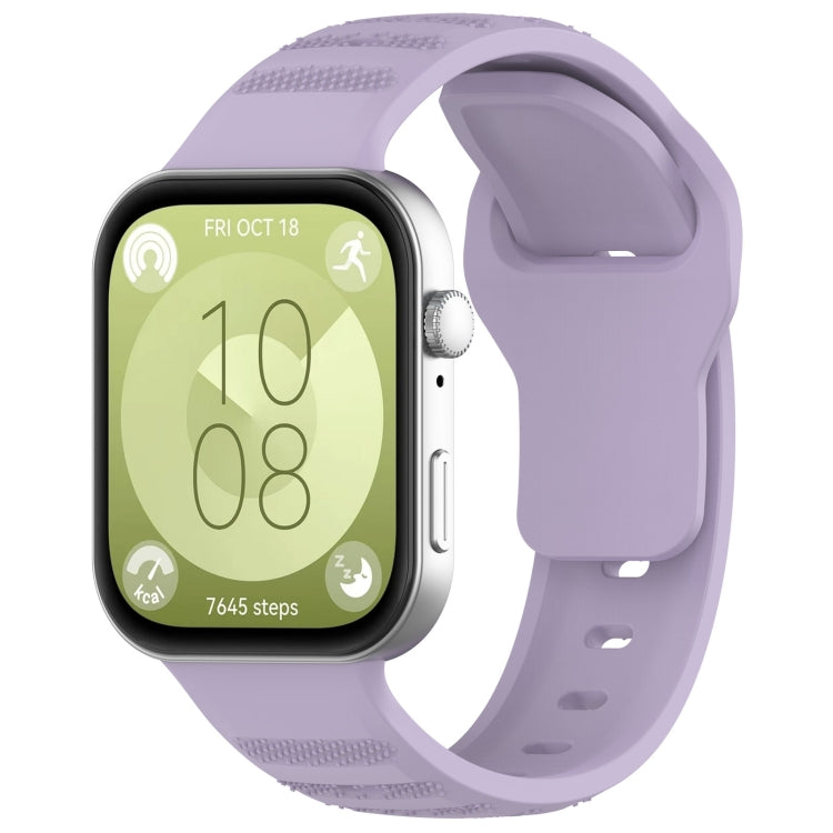 Lavender silicone sports watch band with perforated texture, shown on a smartwatch.