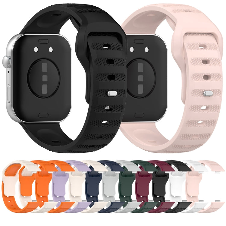 Black and pale pink silicone sports watch bands shown from the back, with perforated texture.