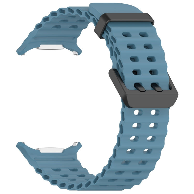 Blue perforated silicone watch band with dual buckle and metal watch connectors