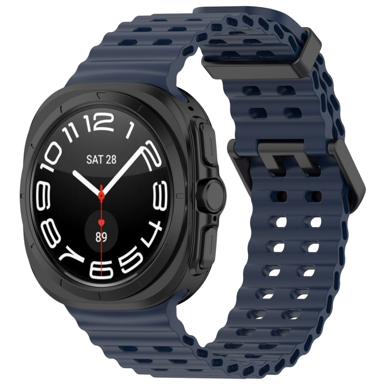 Dark blue silicone watch band with ventilated holes and dual buckle, shown on a smartwatch