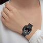 Black perforated silicone watch band worn on a wrist