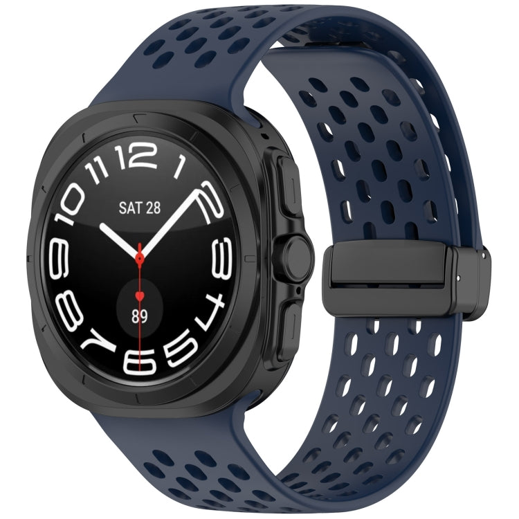 Dark blue perforated silicone watch band with magnetic folding buckle, shown on a smartwatch