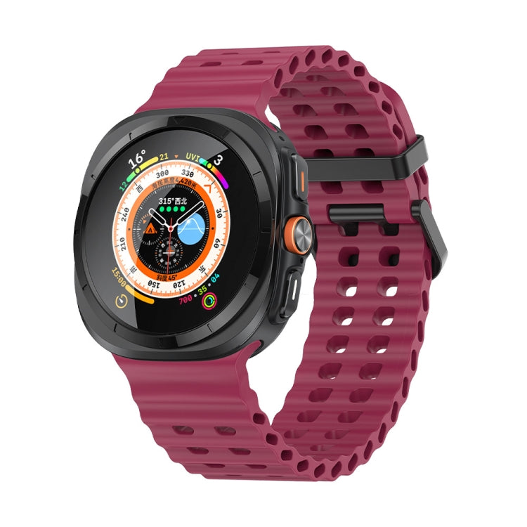 Wine red silicone watch band with dual rows of holes, shown on a smartwatch
