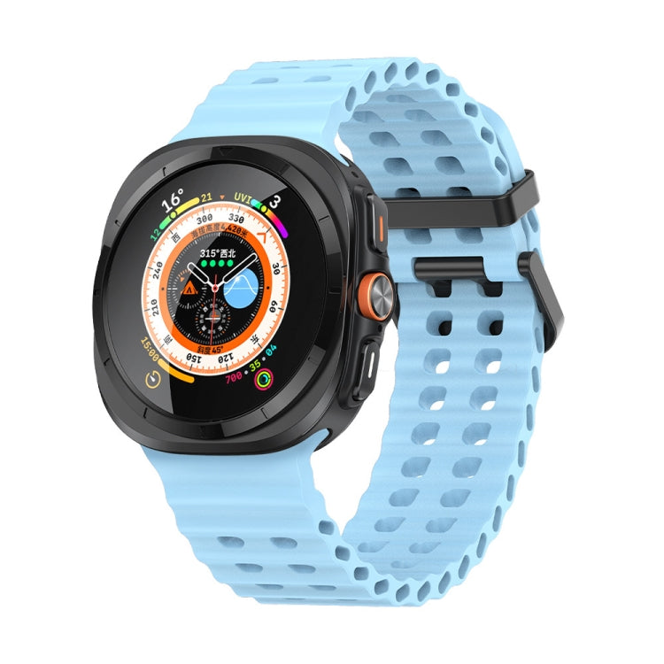 Light blue silicone watch band with two rows of adjustment holes, fitted to a smartwatch.