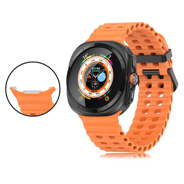 Orange silicone watch band with two rows of holes, fitted to a smartwatch; connector detail inset.