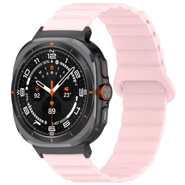 Pink silicone watch band with ridged texture fitted to a smartwatch
