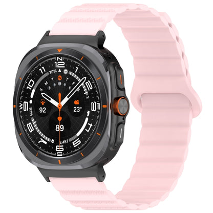 Pink silicone watch band with ridged texture fitted to a smartwatch