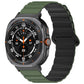 Galaxy Watch Ultra silicone band with a black ridged strap and olive green spotted ends