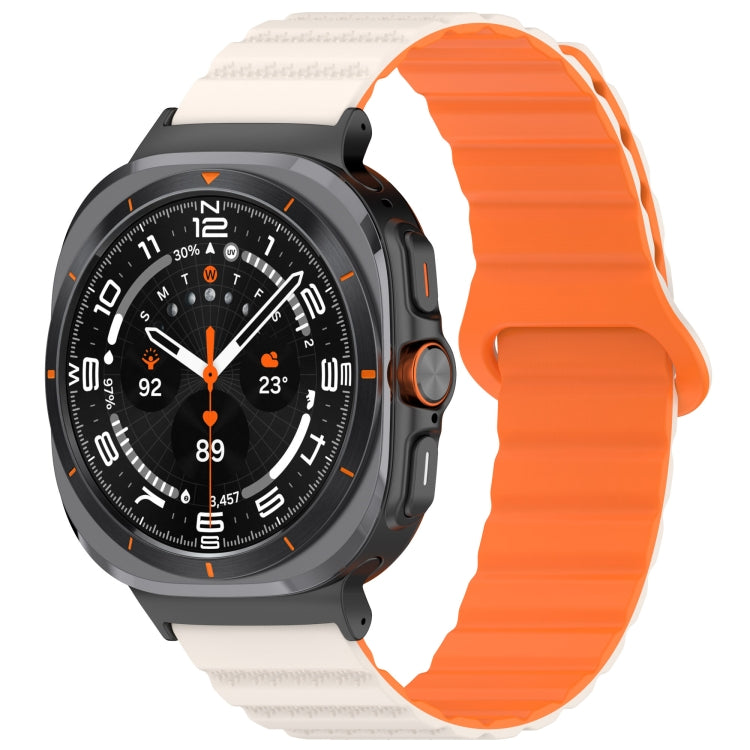 Galaxy Watch Ultra silicone band with an orange ridged strap and cream spotted ends