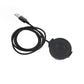 Black USB cable with magnetic charging puck, compact round design