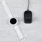 Smartwatch charging set with white band dock, black charging unit, and cable