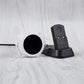 Magnetic smartwatch charging dock with white ring opening and black connector cradle