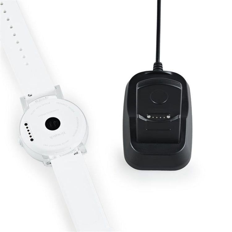 Magnetic charging dock with white watch holder and black charging base, close-up