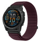 Plum woven nylon hook-and-loop watch band fitted to a rugged smartwatch.