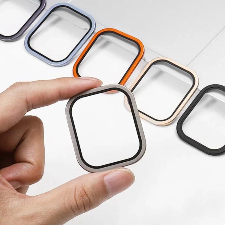 Hand holding a metal frame and tempered glass watch screen protector