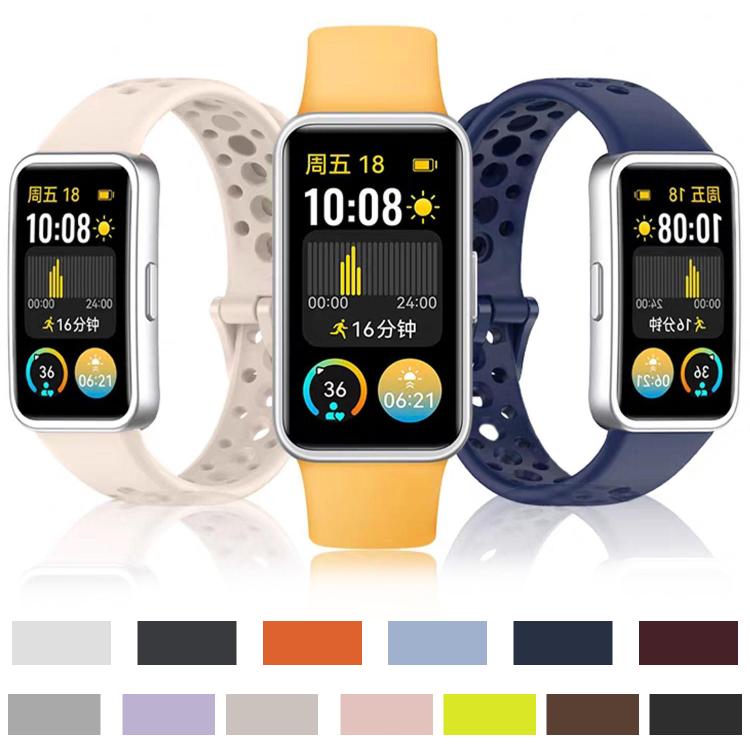 Perforated silicone watch bands in several colors, shown on fitness trackers