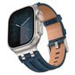 Navy blue vegan leather watch band with silver buckle, shown attached to a silver smartwatch