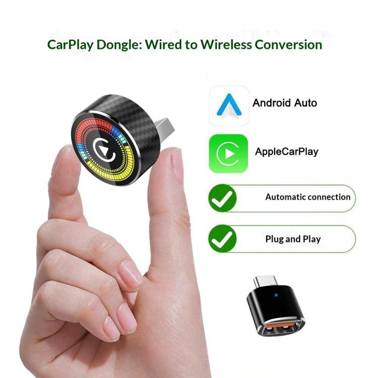 Wireless converter dongle held in hand with USB-A connector and compact black plug