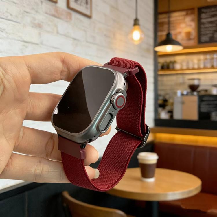 Wine-red elastic watch band with D-ring buckle fitted to a silver smartwatch